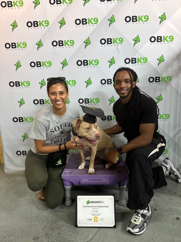 Desera and her partner with Luna at her Obedient K9 graduation